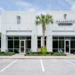 The Office of Grande Oral Specialties showing the parking lot and main doors